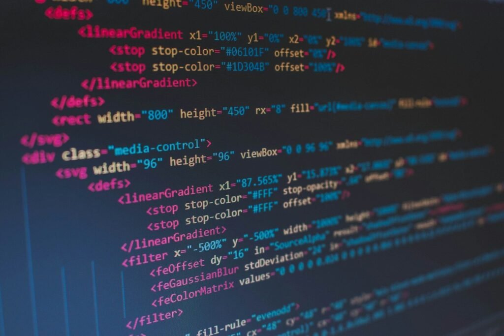 Lines of colorful code on a dark screen, illustrating free AI coding assistants for beginners